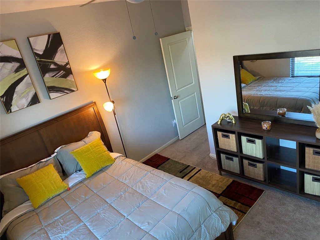 6513 Knox Street Houston, TX 77091 - Photo 6 of 10 a bedroom with a bed and wooden floor