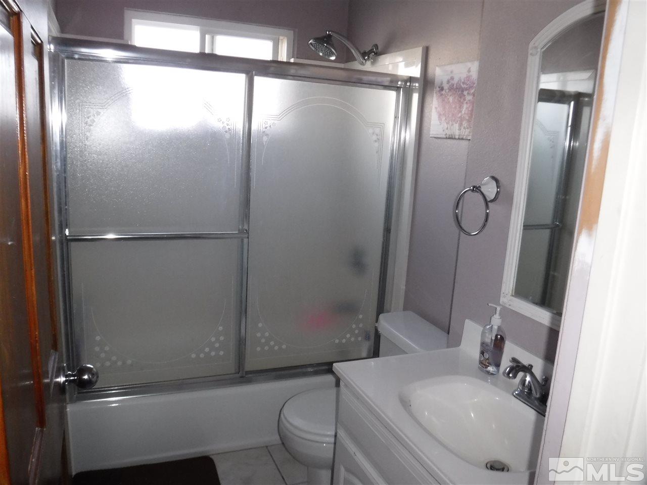 2015 Ives Avenue Reno, NV 89503 - Photo 11 of 21 a bathroom with a sink toilet and shower