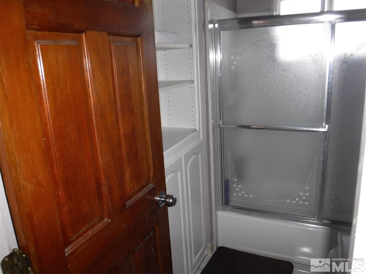 2015 Ives Avenue Reno, NV 89503 - Photo 12 of 21 a bathroom with a glass shower door