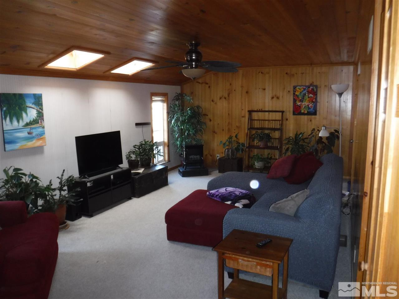 2015 Ives Avenue Reno, NV 89503 - Photo 3 of 21 a living room with furniture and a flat screen tv