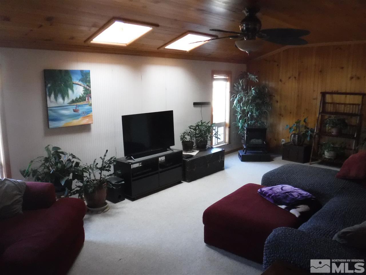 2015 Ives Avenue Reno, NV 89503 - Photo 4 of 21 a living room with furniture and a flat screen tv