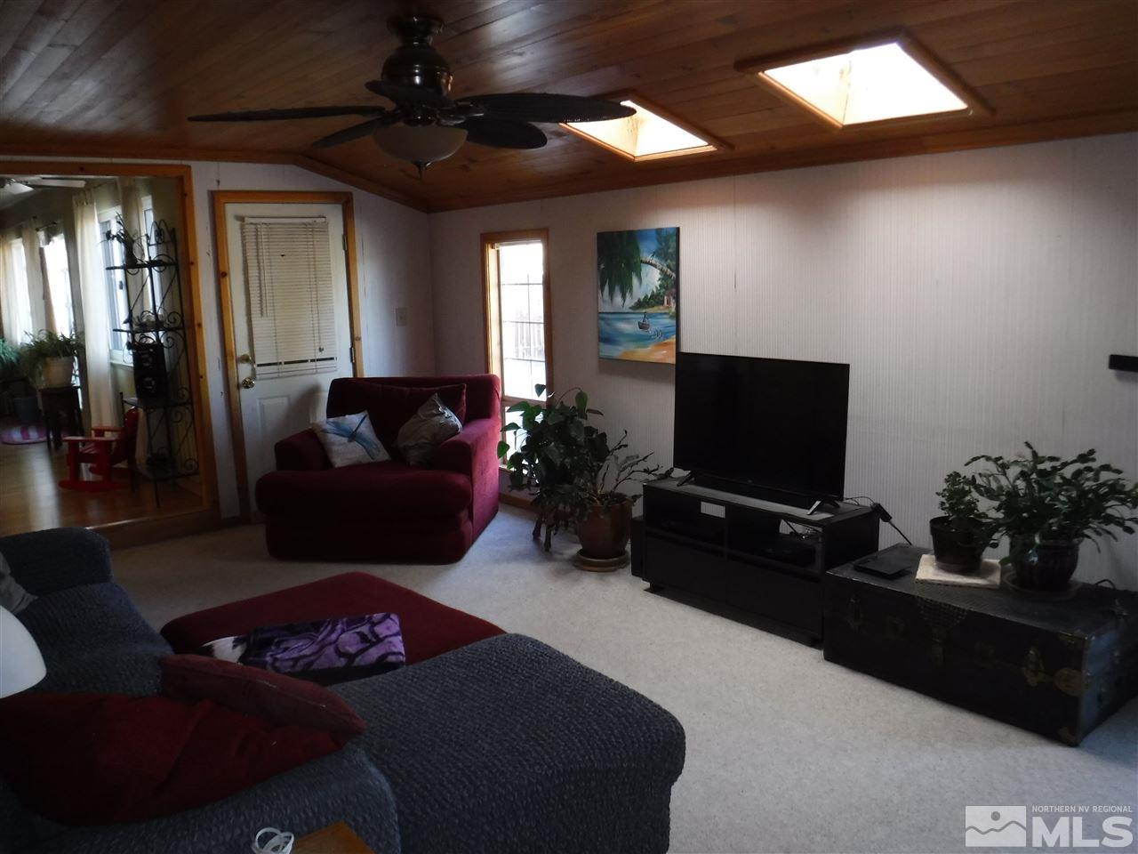 2015 Ives Avenue Reno, NV 89503 - Photo 5 of 21 a living room with furniture and a flat screen tv