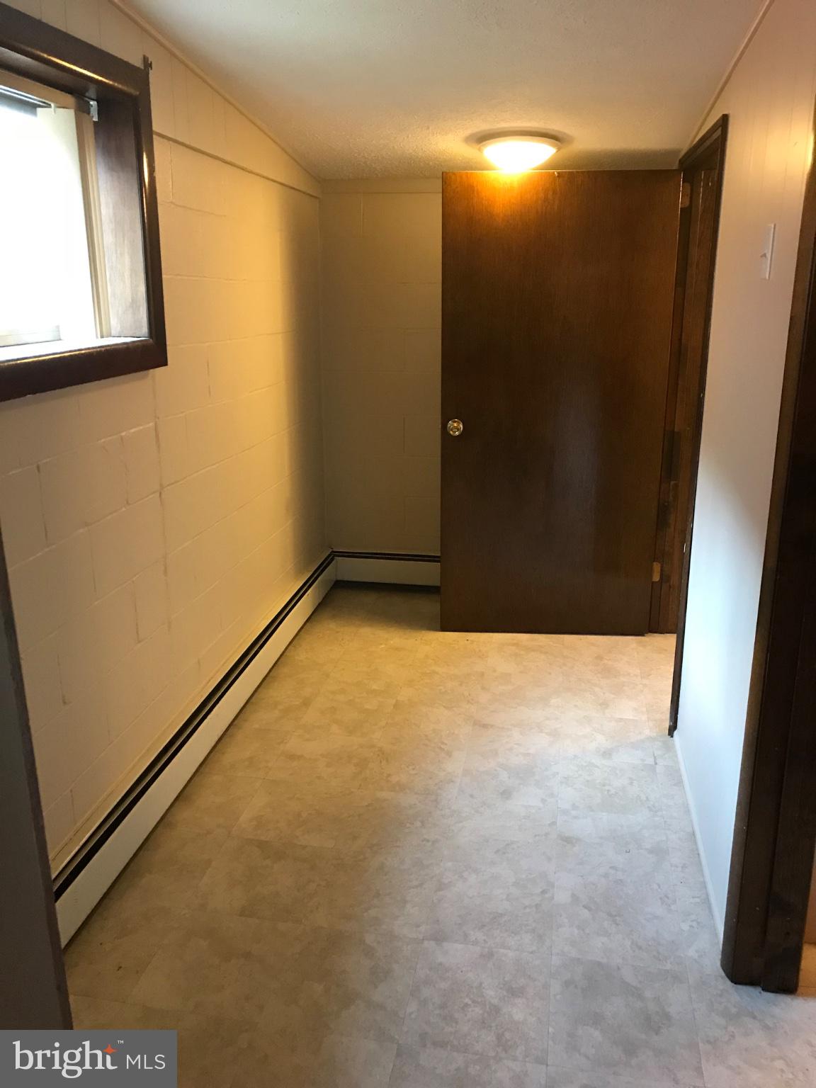 12419 Vale Summit Road Southwest Frostburg, MD 21532 - Photo 36 of 39 Welcoming hallway with natural light.
