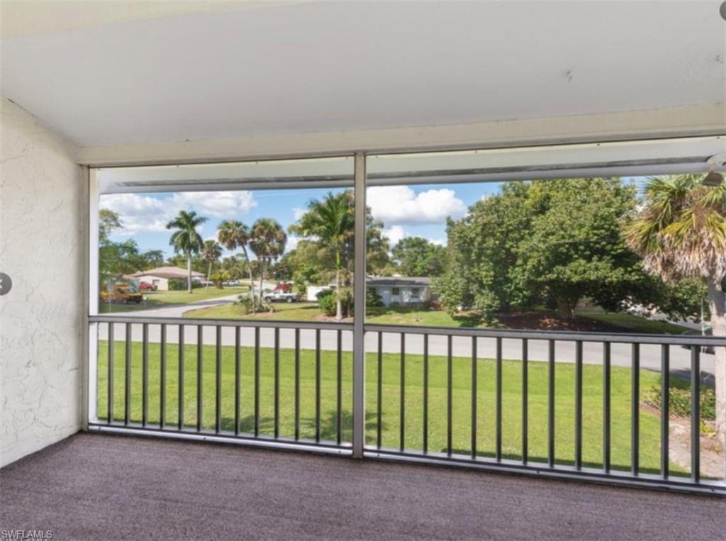 4900 Biscayne Drive, Unit 23 Naples, FL 34112 - Photo 11 of 12 a view of a garden from a balcony