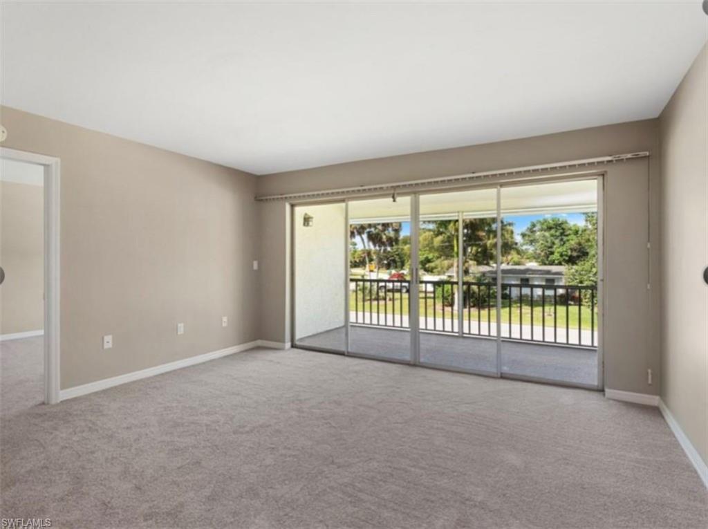 4900 Biscayne Drive, Unit 23 Naples, FL 34112 - Photo 5 of 12 a view of an empty room with glass windows