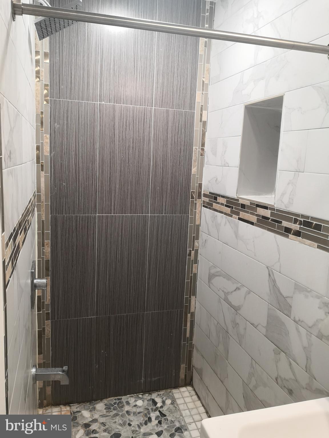 1008 Green Street Philadelphia, PA 19123 - Photo 17 of 40 a bathroom with a shower and a sink