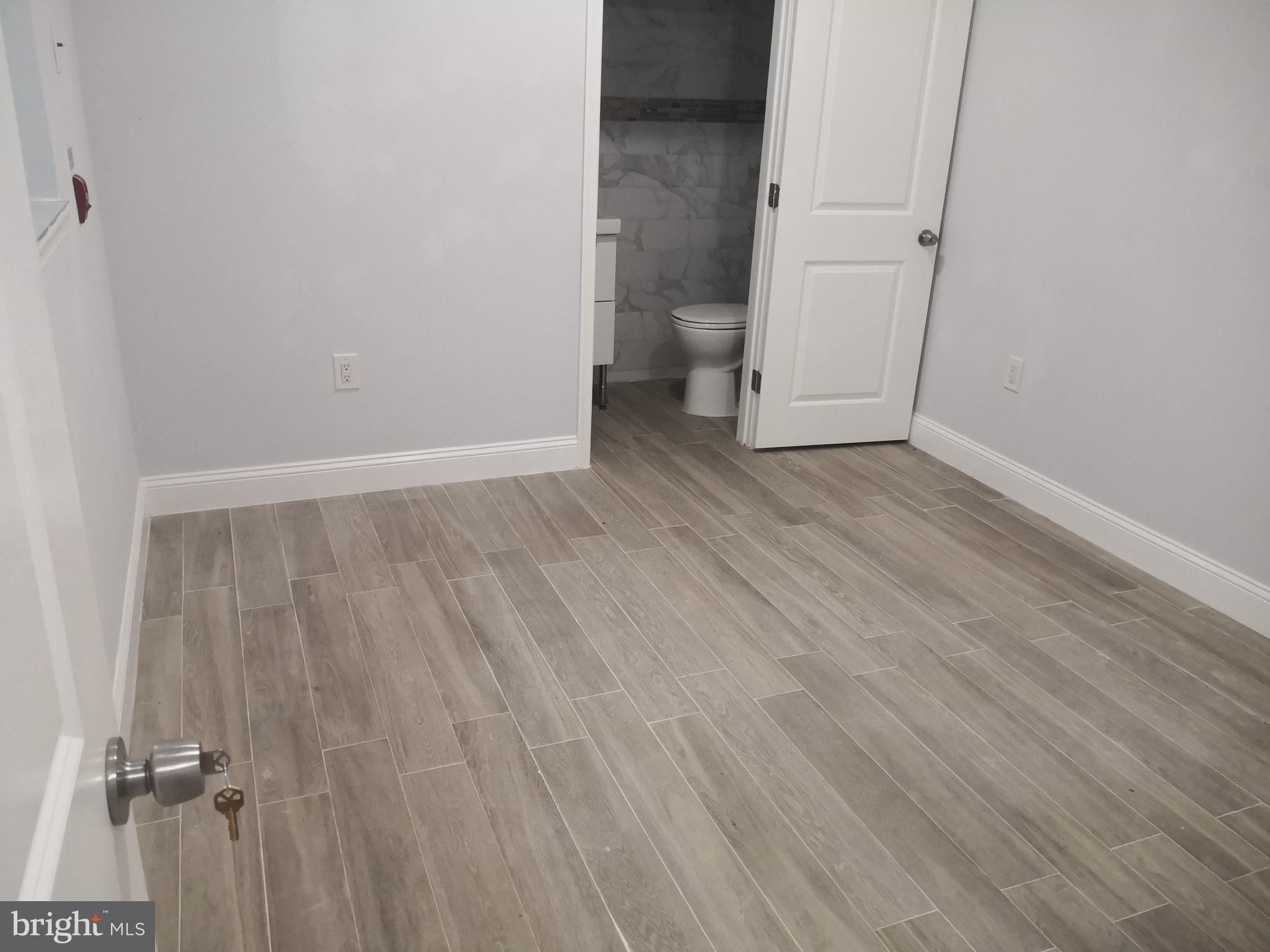 1008 Green Street Philadelphia, PA 19123 - Photo 20 of 40 a view of an empty room with wooden floor