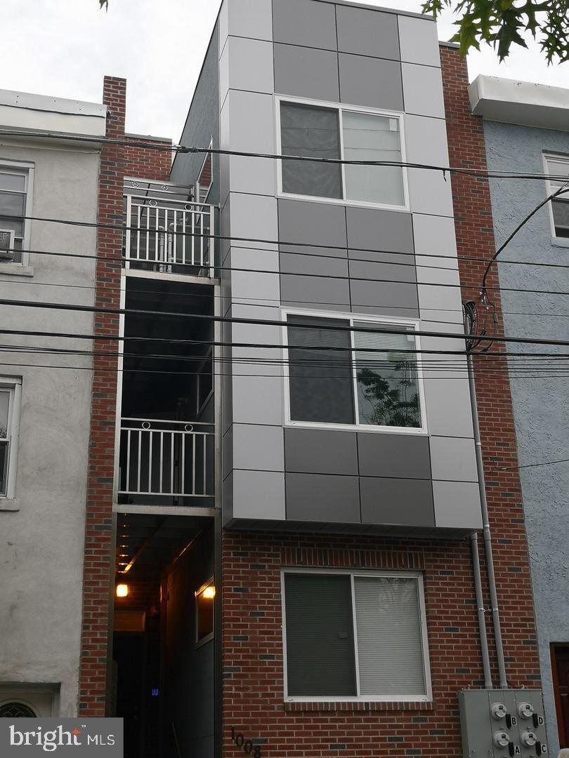 1008 Green Street Philadelphia, PA 19123 - Photo 2 of 40 a view of a house with a window