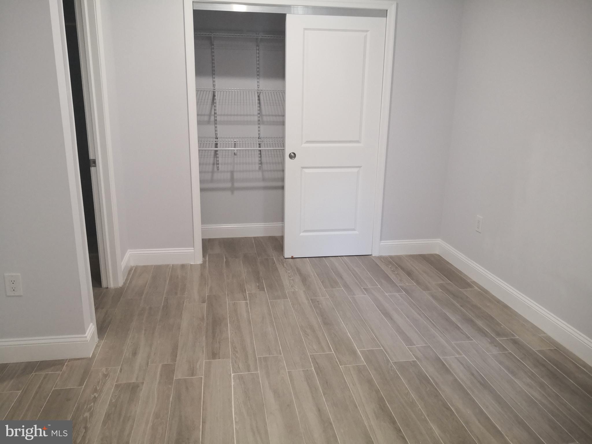 1008 Green Street Philadelphia, PA 19123 - Photo 21 of 40 an empty room with wooden floor and closet