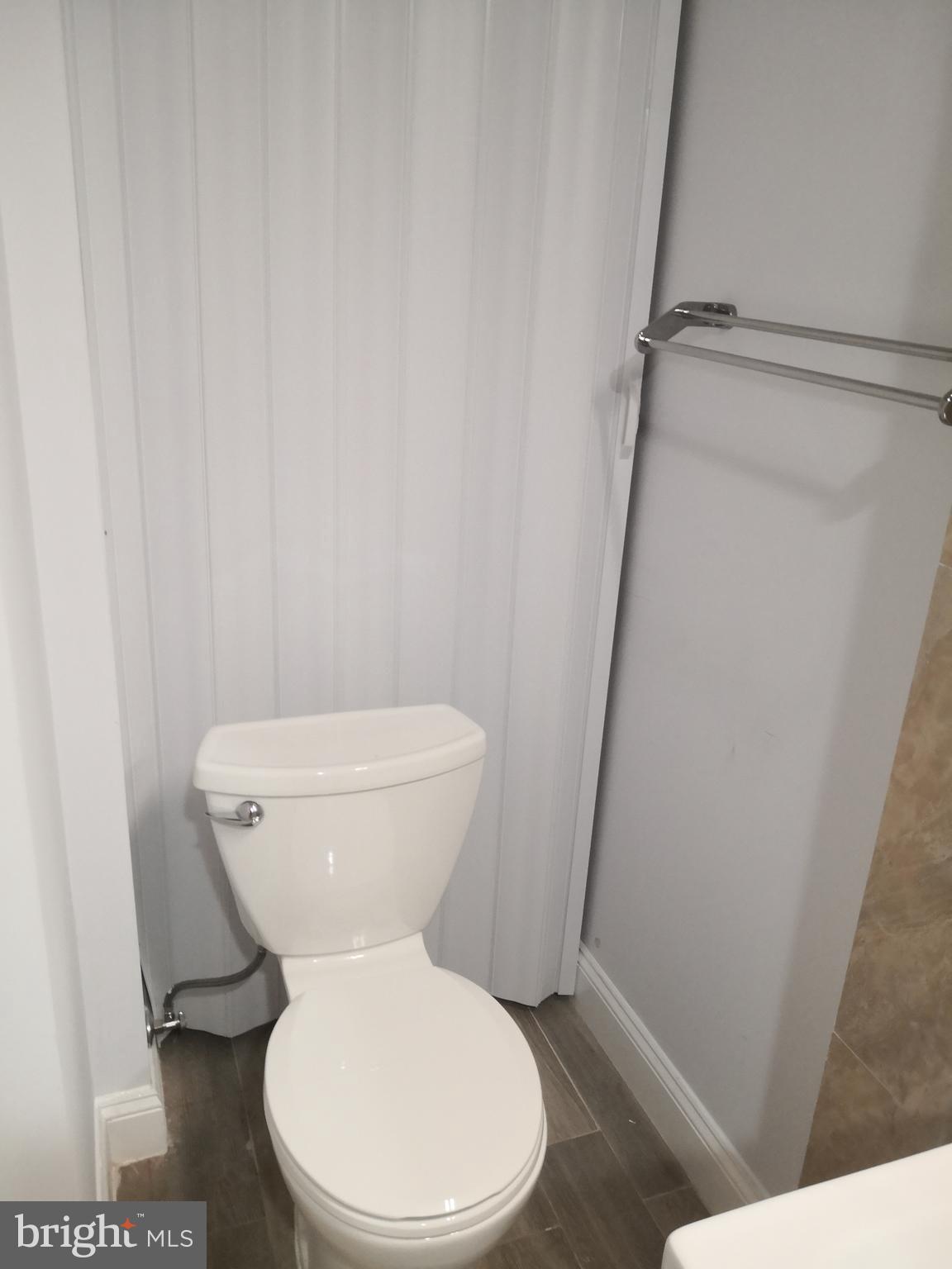 1008 Green Street Philadelphia, PA 19123 - Photo 23 of 40 a white toilet sitting next to a shower
