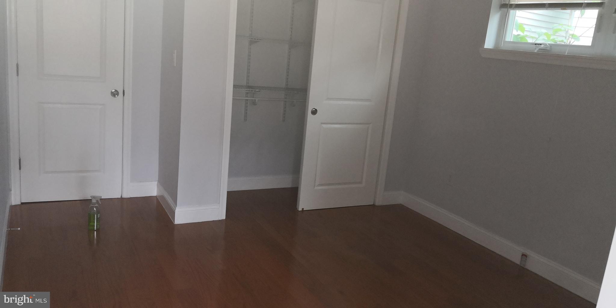 1008 Green Street Philadelphia, PA 19123 - Photo 37 of 40 an empty room with wooden floor and windows