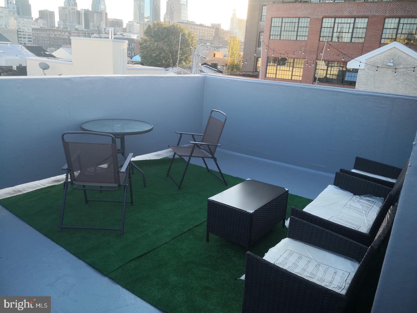 1008 Green Street Philadelphia, PA 19123 - Photo 6 of 40 a view of a chairs and table in a balcony