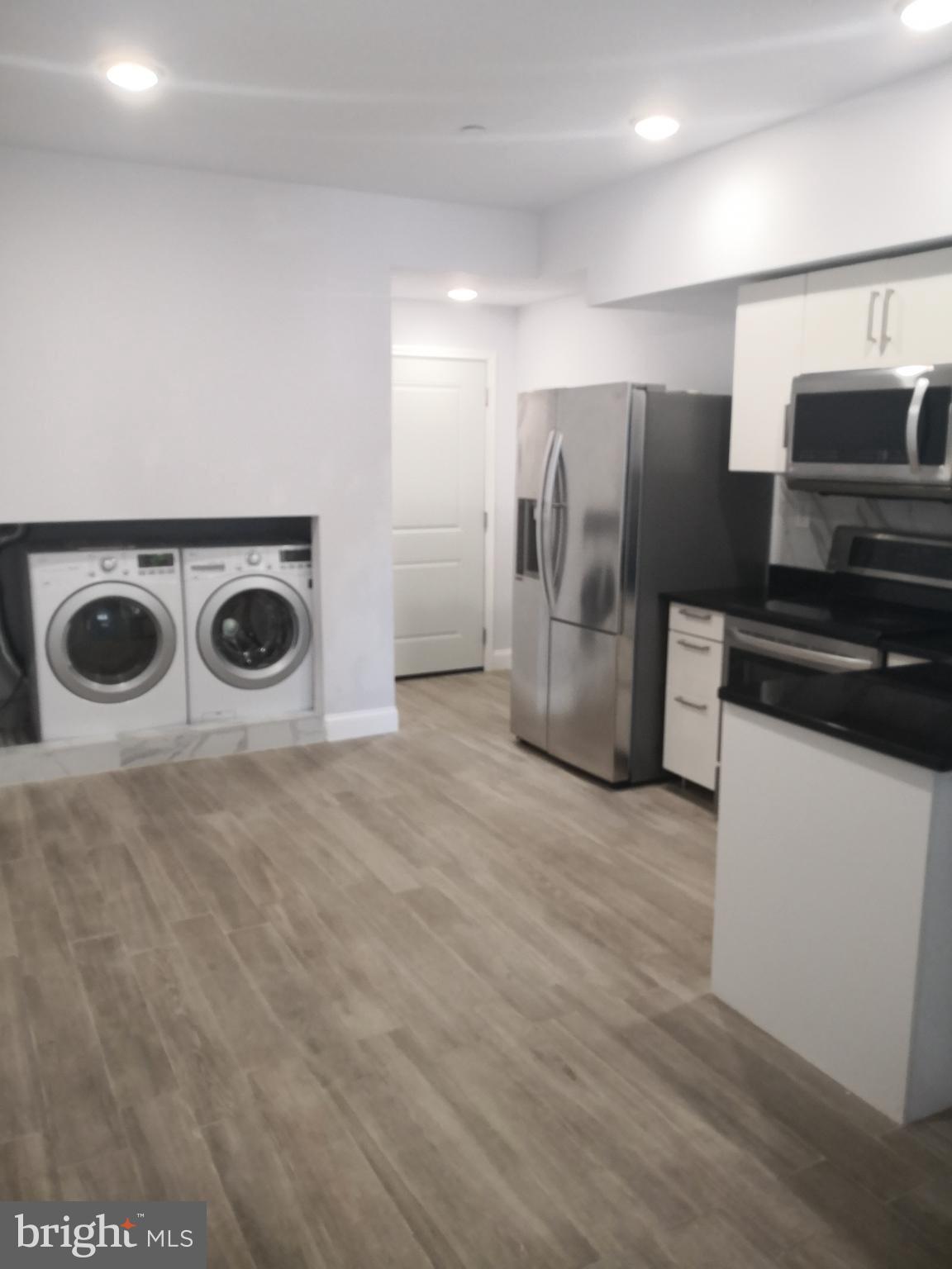 1008 Green Street Philadelphia, PA 19123 - Photo 10 of 40 a kitchen with stainless steel appliances a refrigerator and a stove top oven