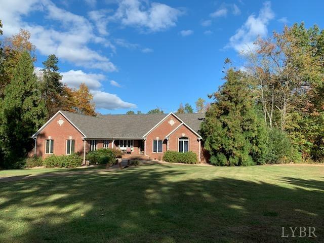 2206 South Fork Road Appomattox, VA 24522 - Photo 3 of 78 a front view of a house with a garden