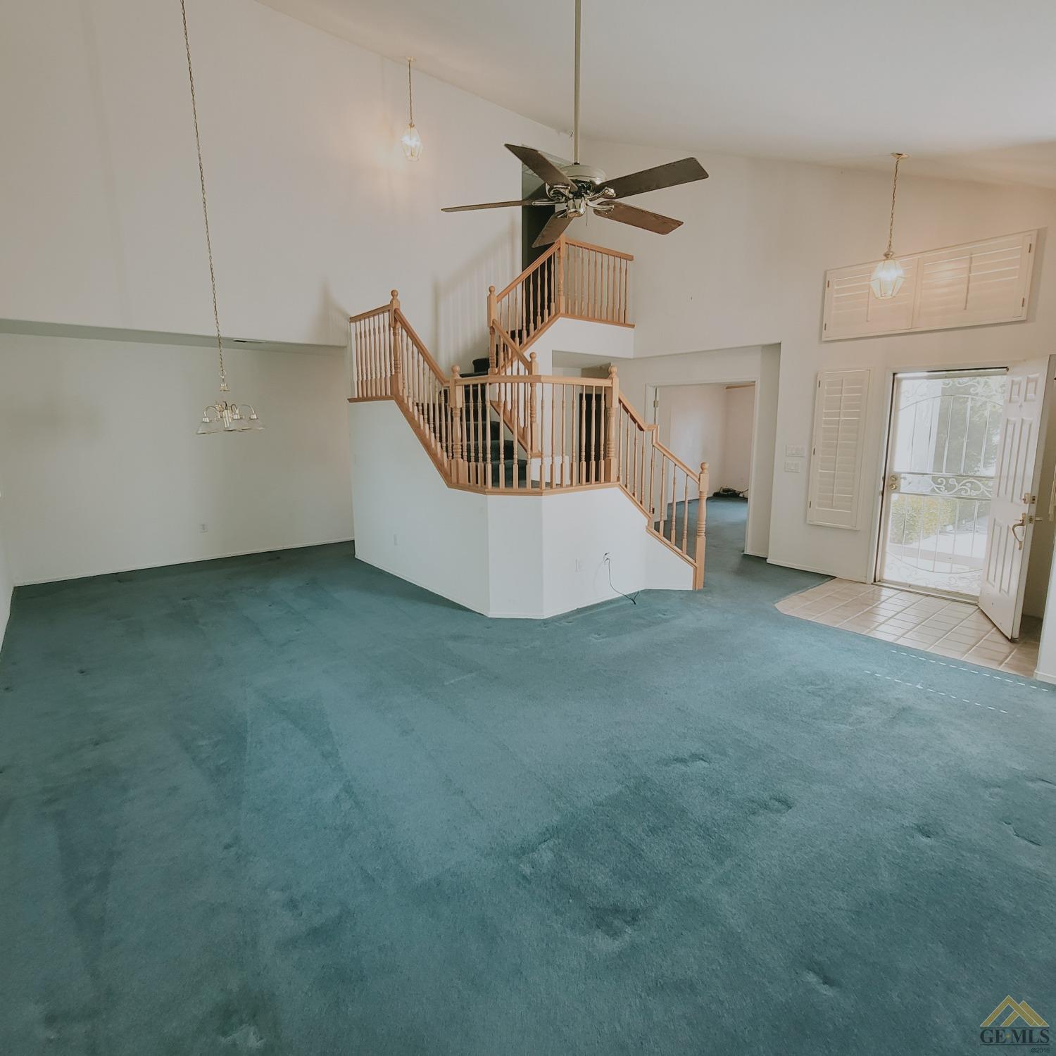 Undisclosed Address Bakersfield, CA 93313 - Photo 13 of 24 a view of an empty room with a kitchen