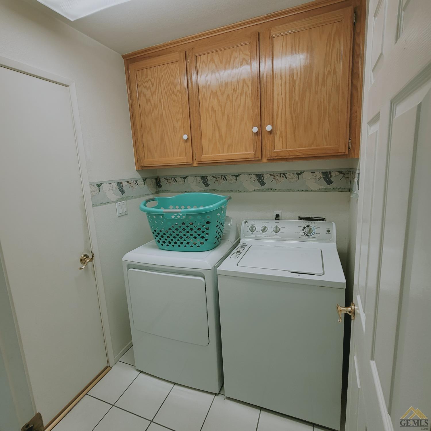 Undisclosed Address Bakersfield, CA 93313 - Photo 6 of 24 The Laundry Area Is Conveniently Located Between The Garage And Kitchen