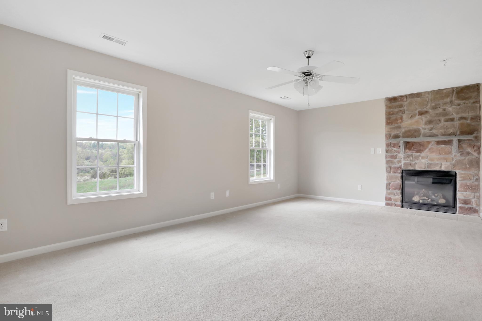 261 Fairview Road Gore, VA 22637 - Photo 31 of 45 Primary bedroom with fireplace