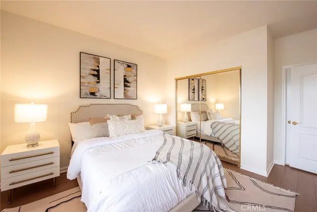 a bedroom with a bed and a lamp