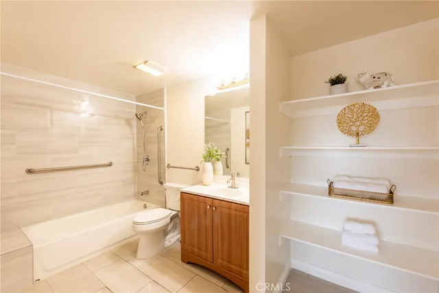 a bathroom with a bathtub shower sink and toilet