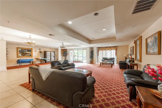 a bedroom with furniture and a large window