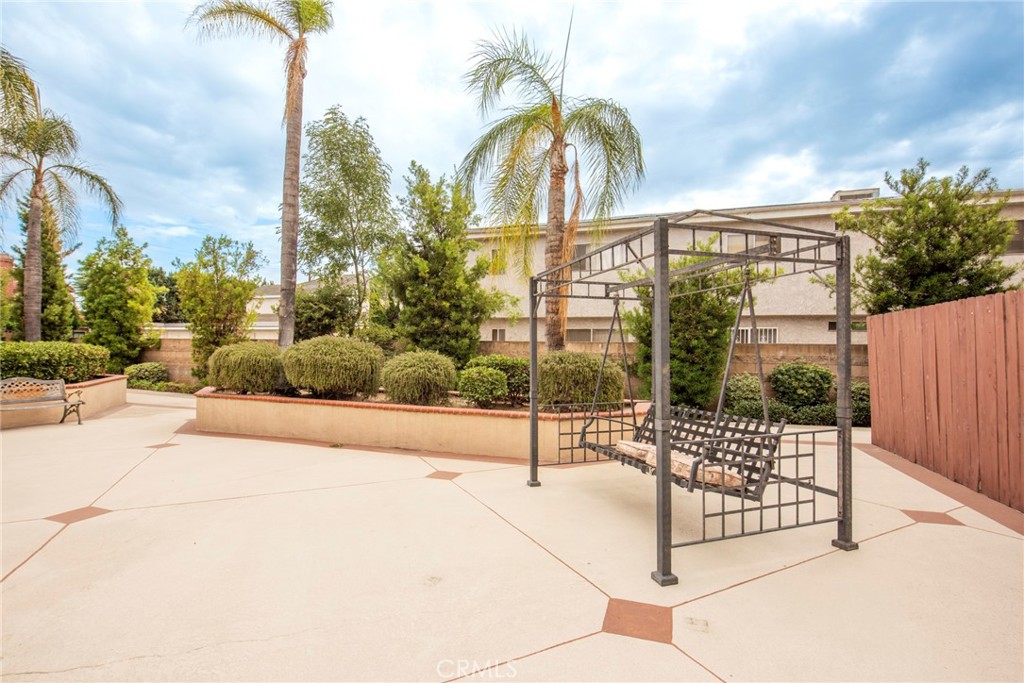 208 North Lincoln Avenue, Unit 309 Monterey Park, CA 91755 - Photo 21 of 26 a view of a garden with wooden fence