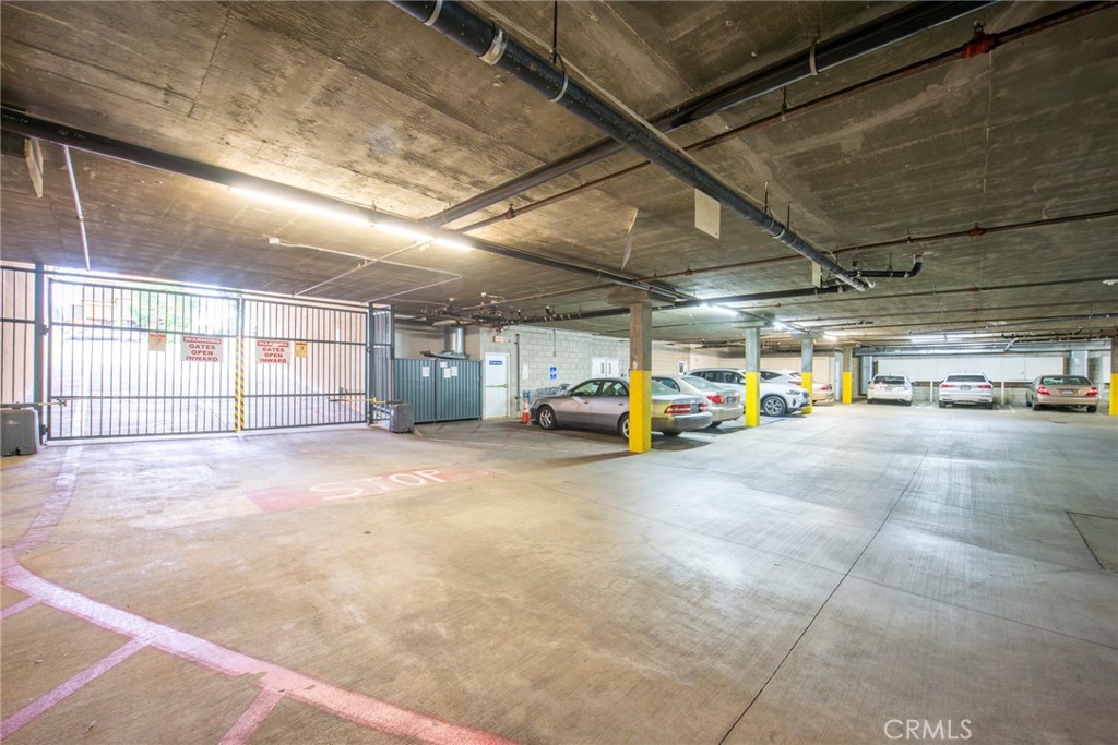 208 North Lincoln Avenue, Unit 309 Monterey Park, CA 91755 - Photo 22 of 26 a view of parking garage with cars