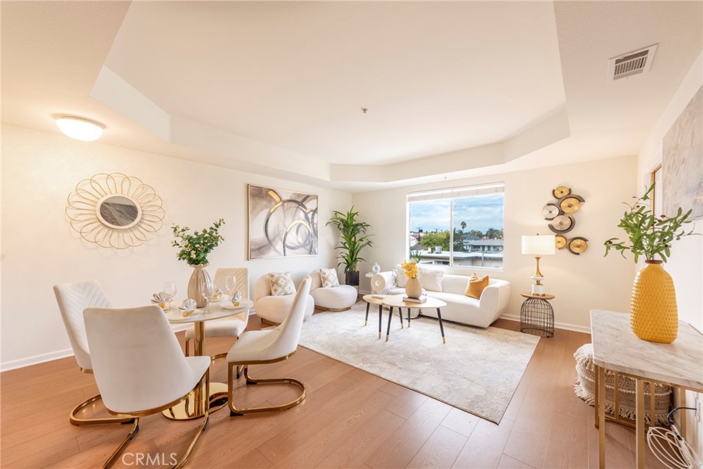 208 North Lincoln Avenue, Unit 309 Monterey Park, CA 91755 - Photo 3 of 26 a living room with fireplace furniture and a potted plant