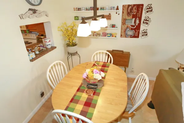 a living room with furniture and a clock
