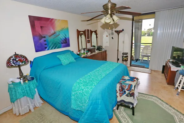 a white toilet sitting next to a shower curtain