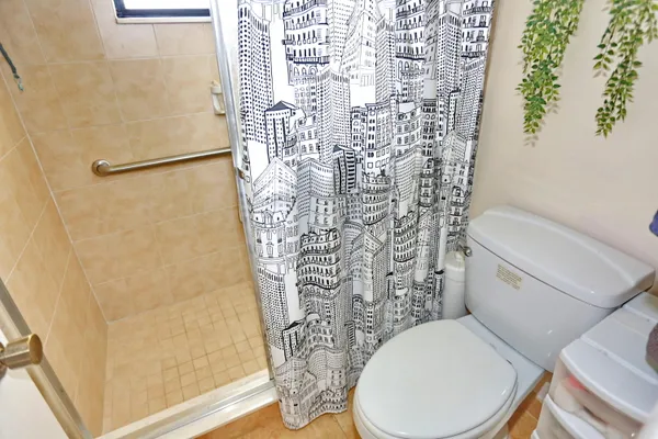 a front view of a building with a yard