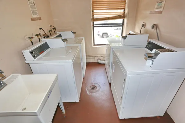 a view of a swimming pool with an outdoor seating and yard