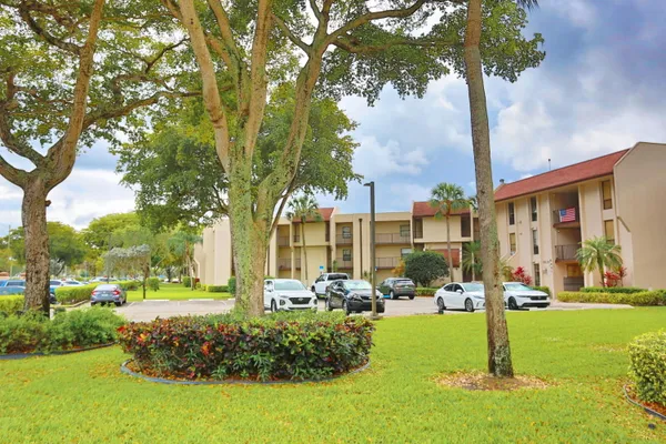 a view of a swimming pool with a yard