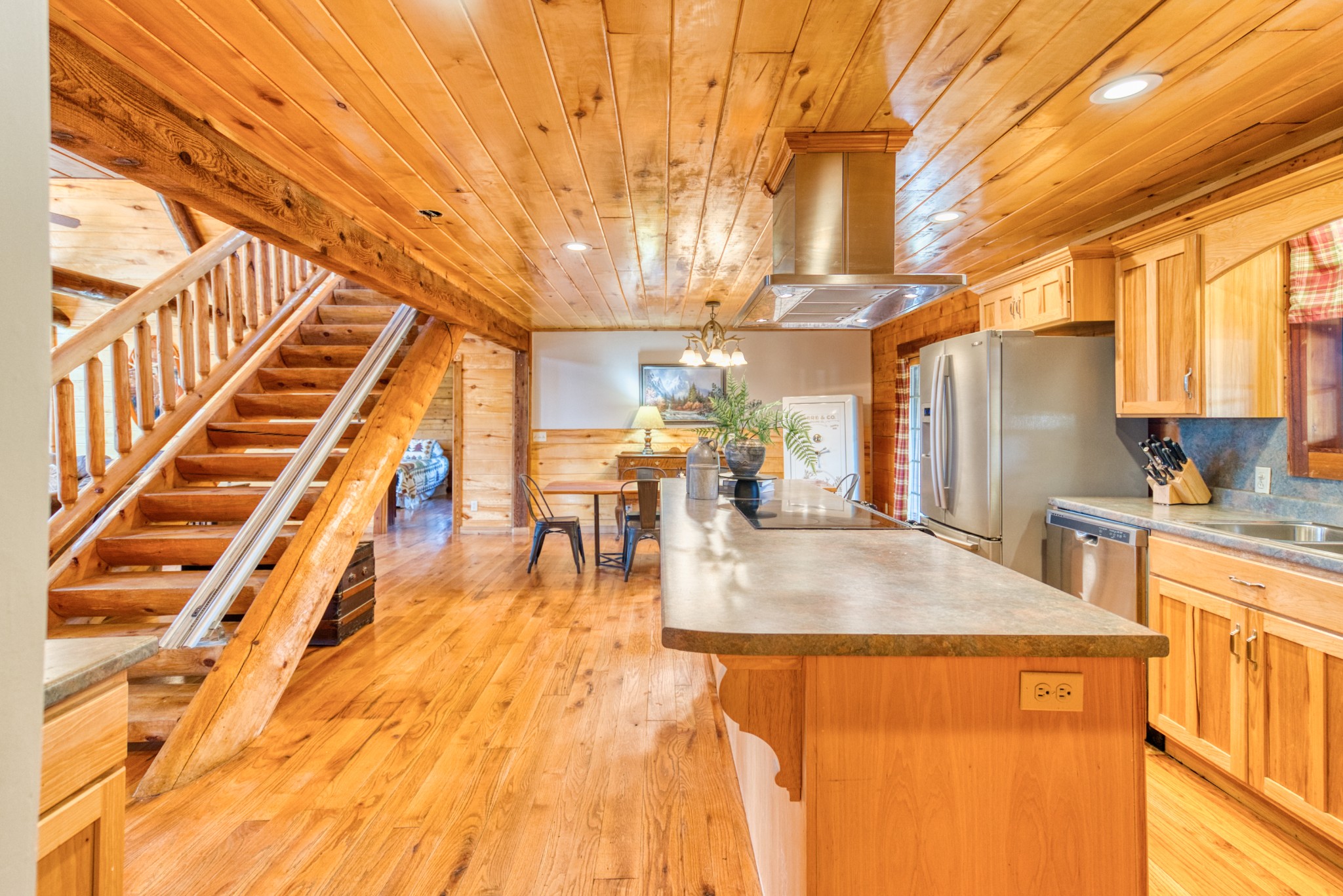 2644 Franklin Road Russellville, KY 42276 - Photo 11 of 40 a view of living room with kitchen island granite countertop wooden floor and stainless steel appliances