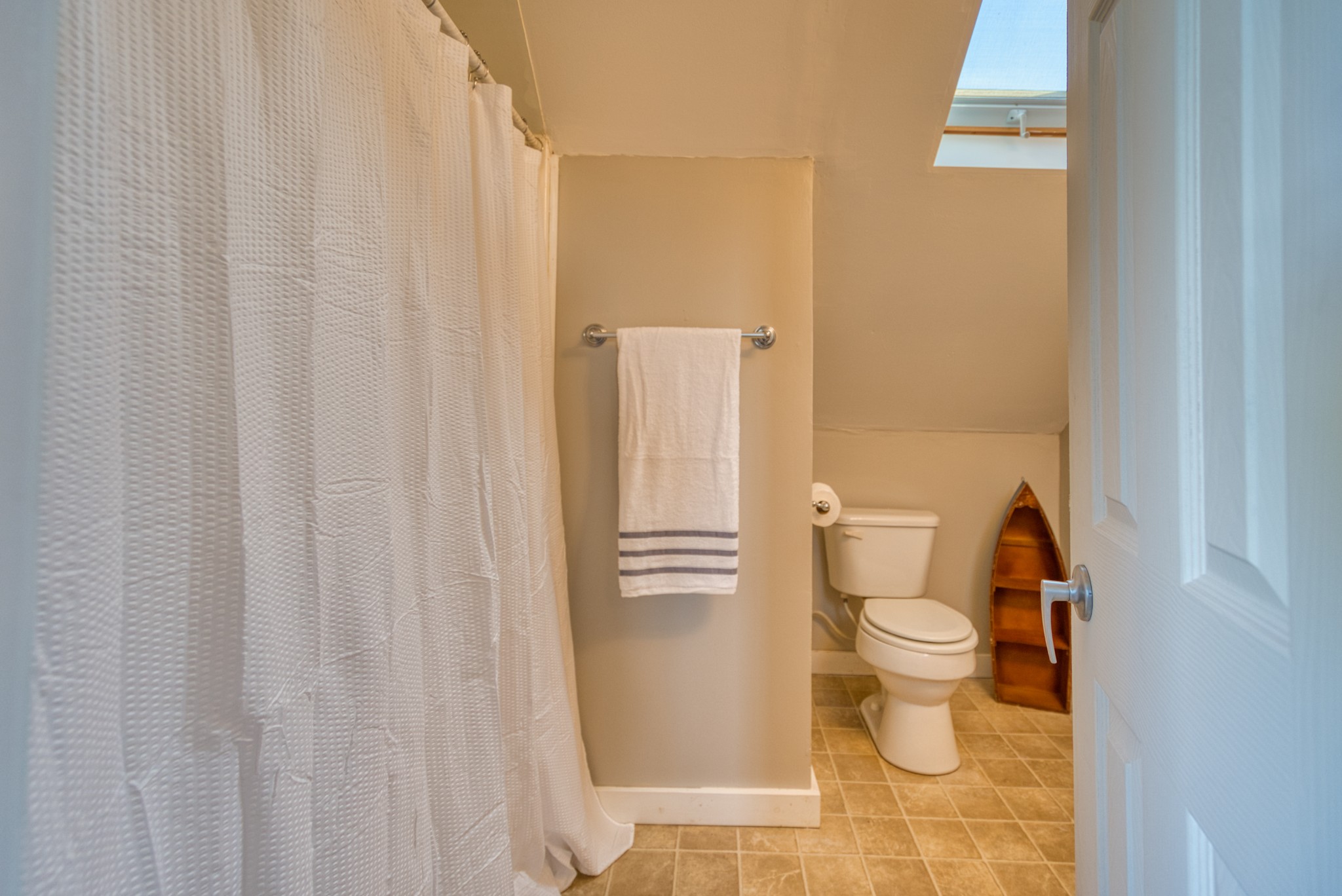 2644 Franklin Road Russellville, KY 42276 - Photo 25 of 40 a white toilet sitting next to a shower curtain
