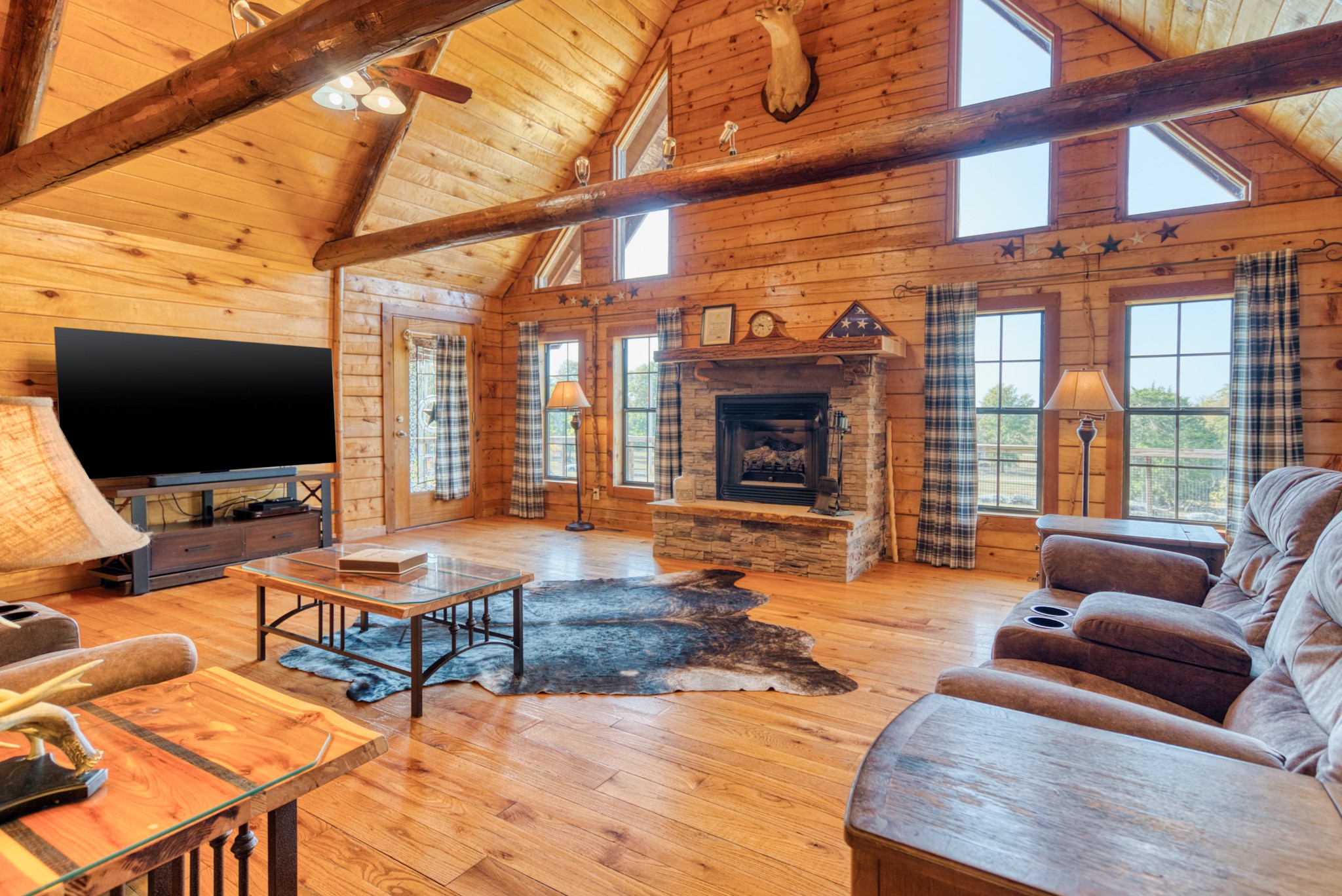 2644 Franklin Road Russellville, KY 42276 - Photo 5 of 40 a outdoor living space with furniture a flat screen tv and a floor to ceiling window