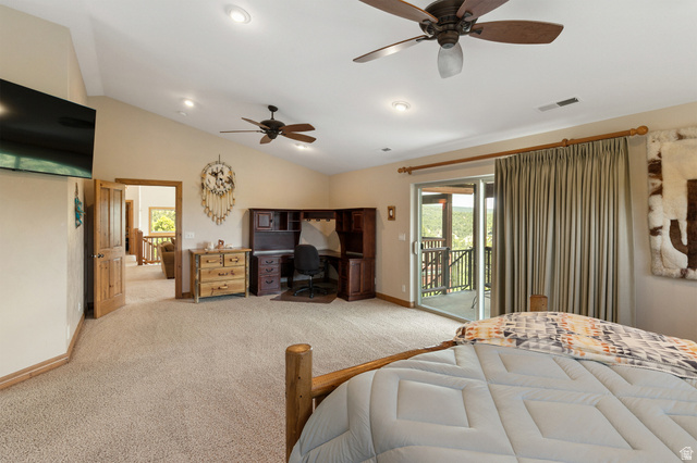 755 South Zion Ridge Drive Orderville, UT 84758 - Photo 67 of 84 Bedroom with a ceiling fan, access to exterior, light colored carpet, vaulted ceiling, and an office area
