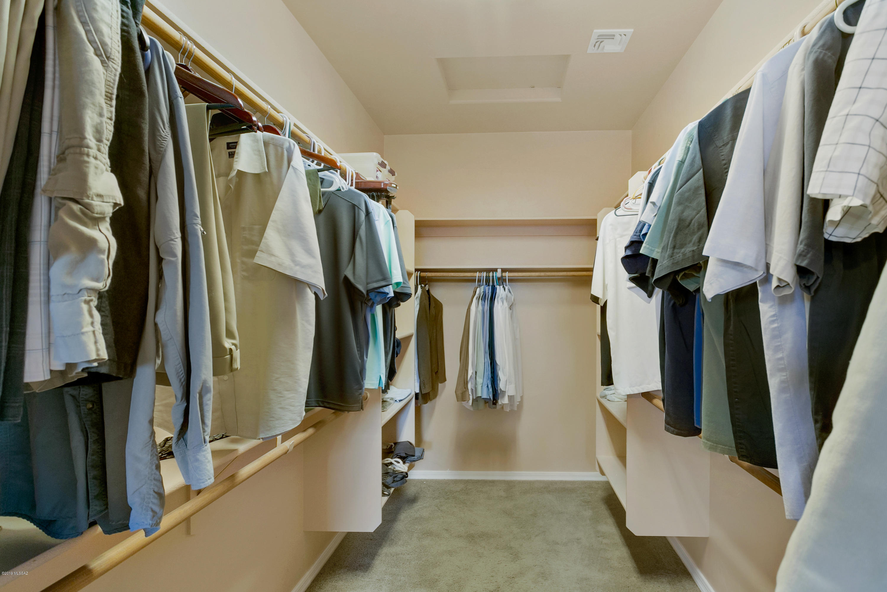 21960 South Helvetia Road Sahuarita, AZ 85629 - Photo 21 of 29 a view of walk in closet with clothes and shoes