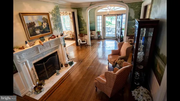 a living room with furniture fireplace and flat screen tv