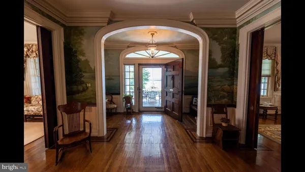 a view of a entryway door with wooden floor