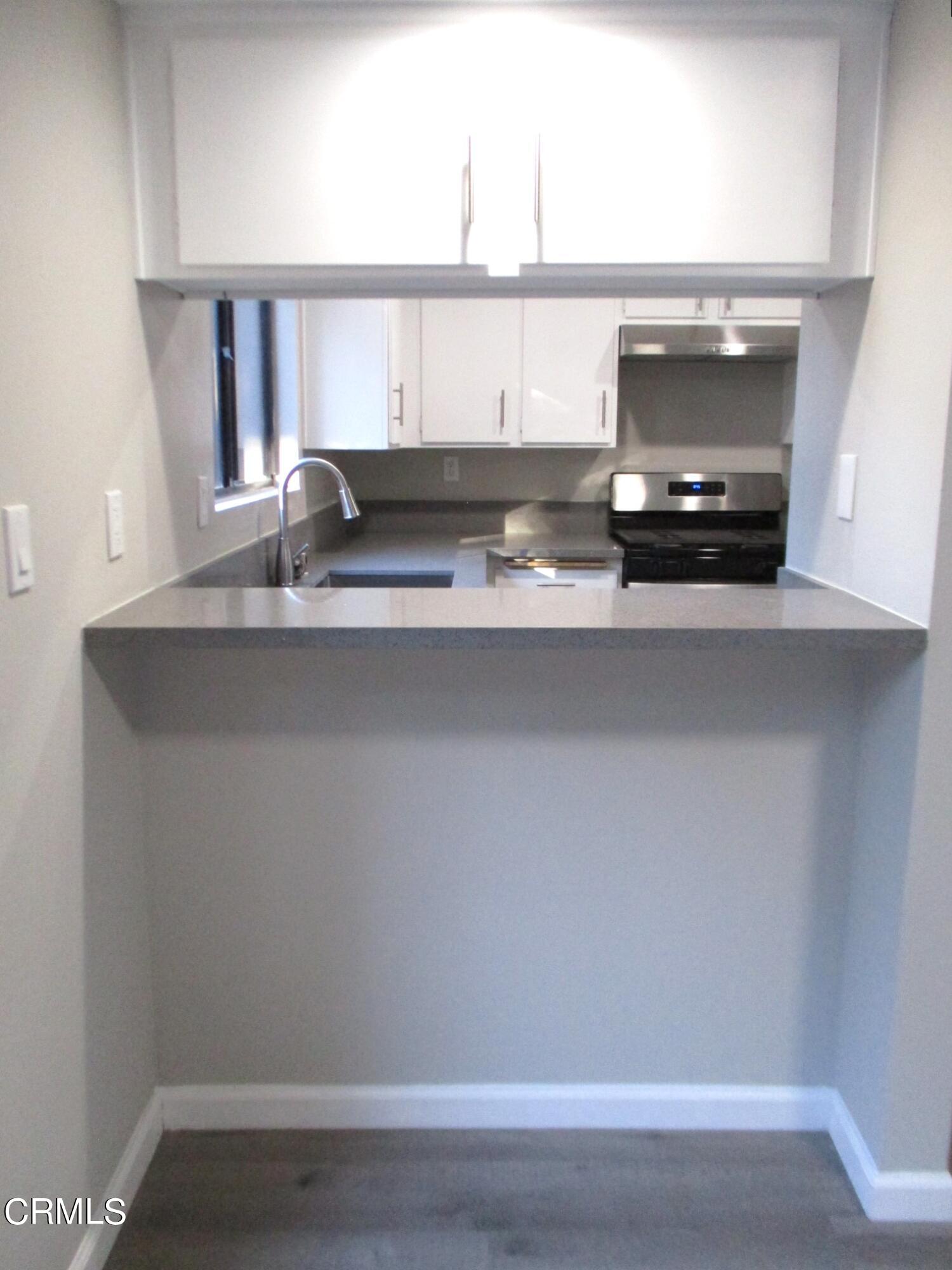 375 West Walnut Street Pasadena, CA 91103 - Photo 12 of 42 a kitchen with a sink and a microwave