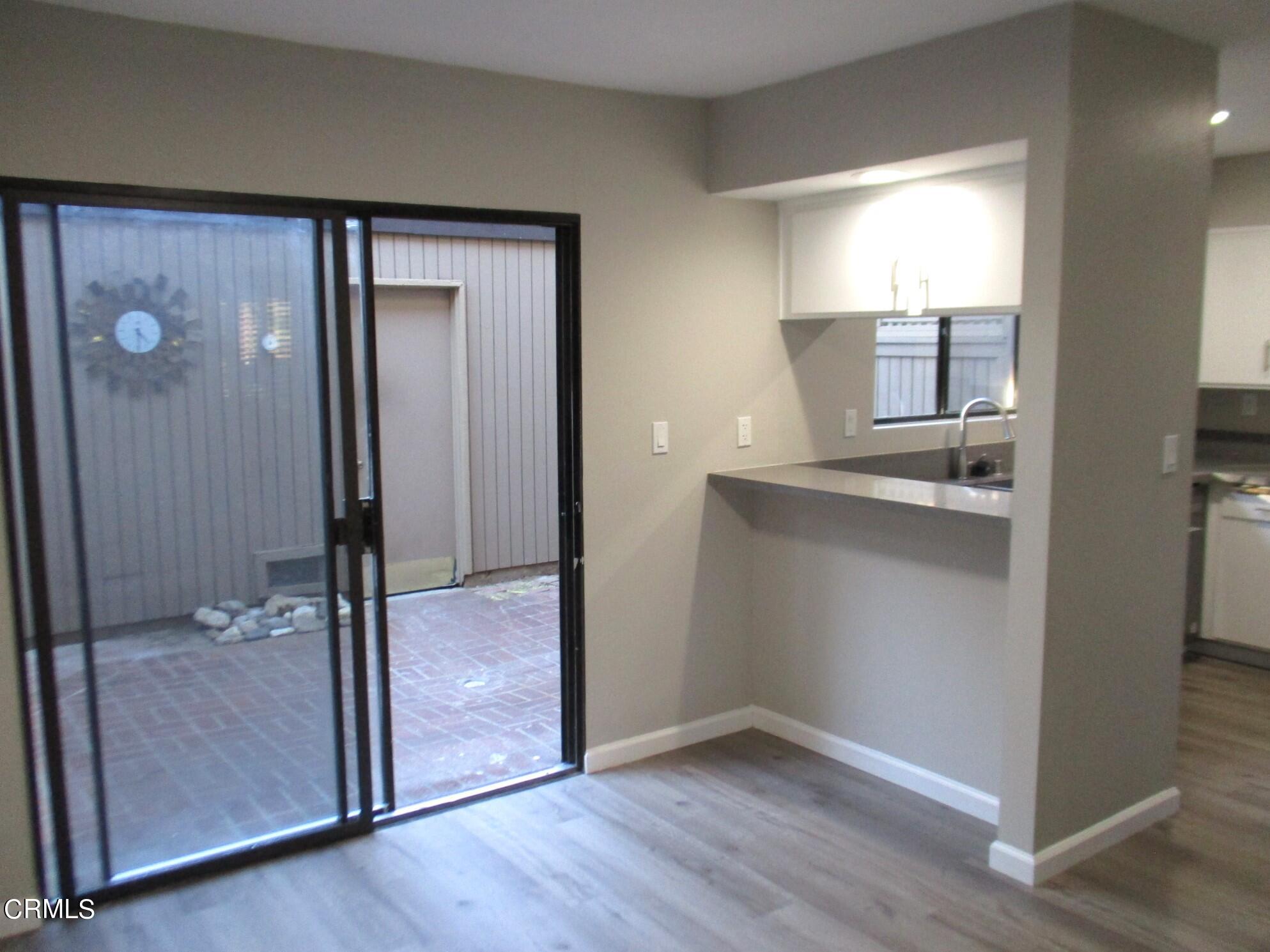 375 West Walnut Street Pasadena, CA 91103 - Photo 14 of 42 an empty room with wooden floor and a bathroom