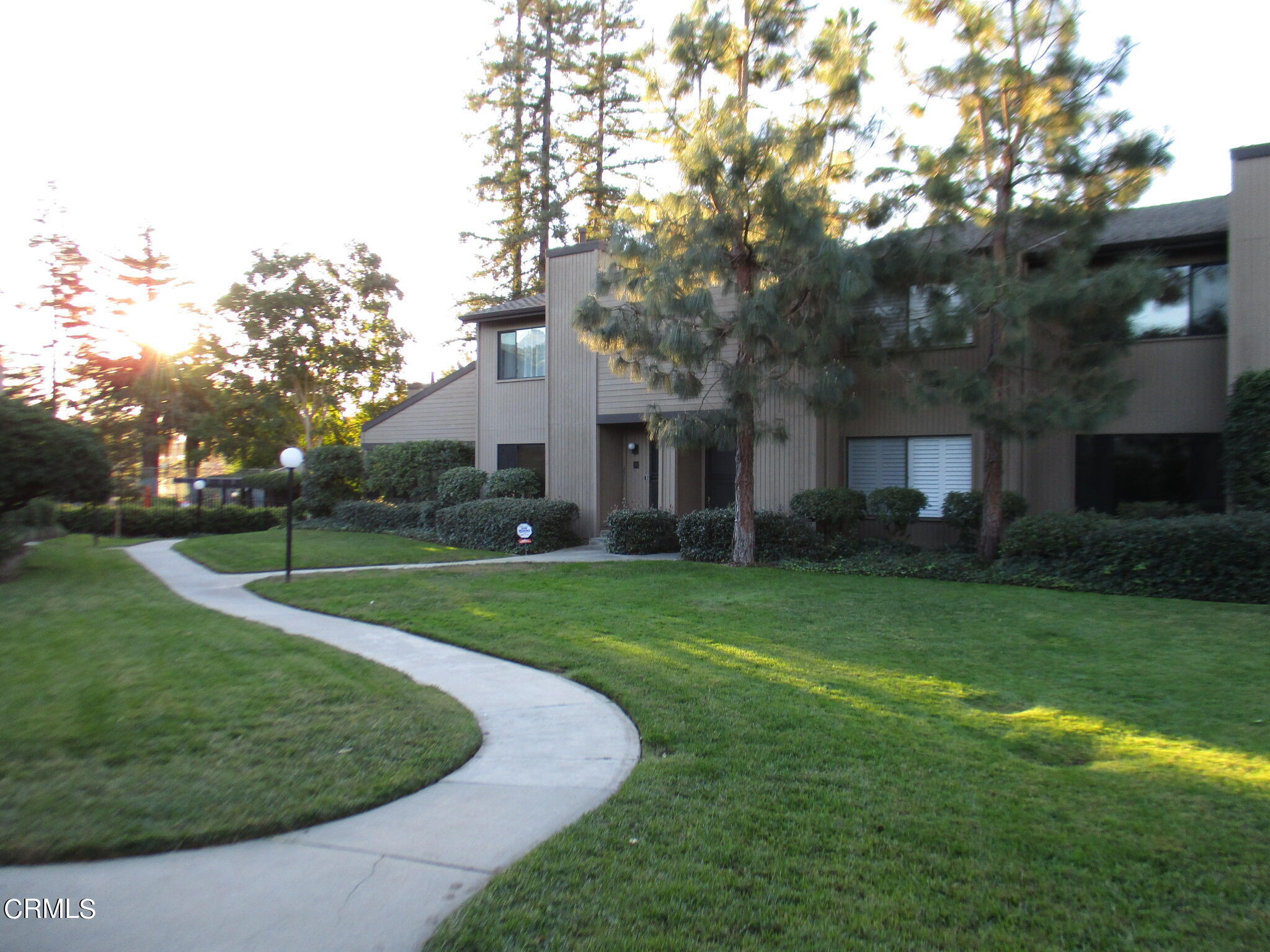 375 West Walnut Street Pasadena, CA 91103 - Photo 2 of 42 a view of a house with a big yard plants and large trees
