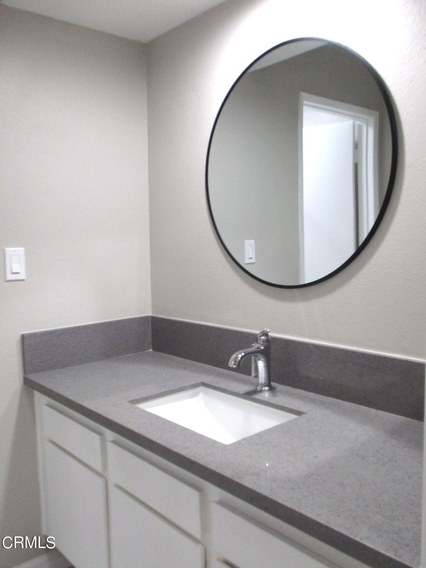 375 West Walnut Street Pasadena, CA 91103 - Photo 21 of 42 a bathroom with a sink and a mirror