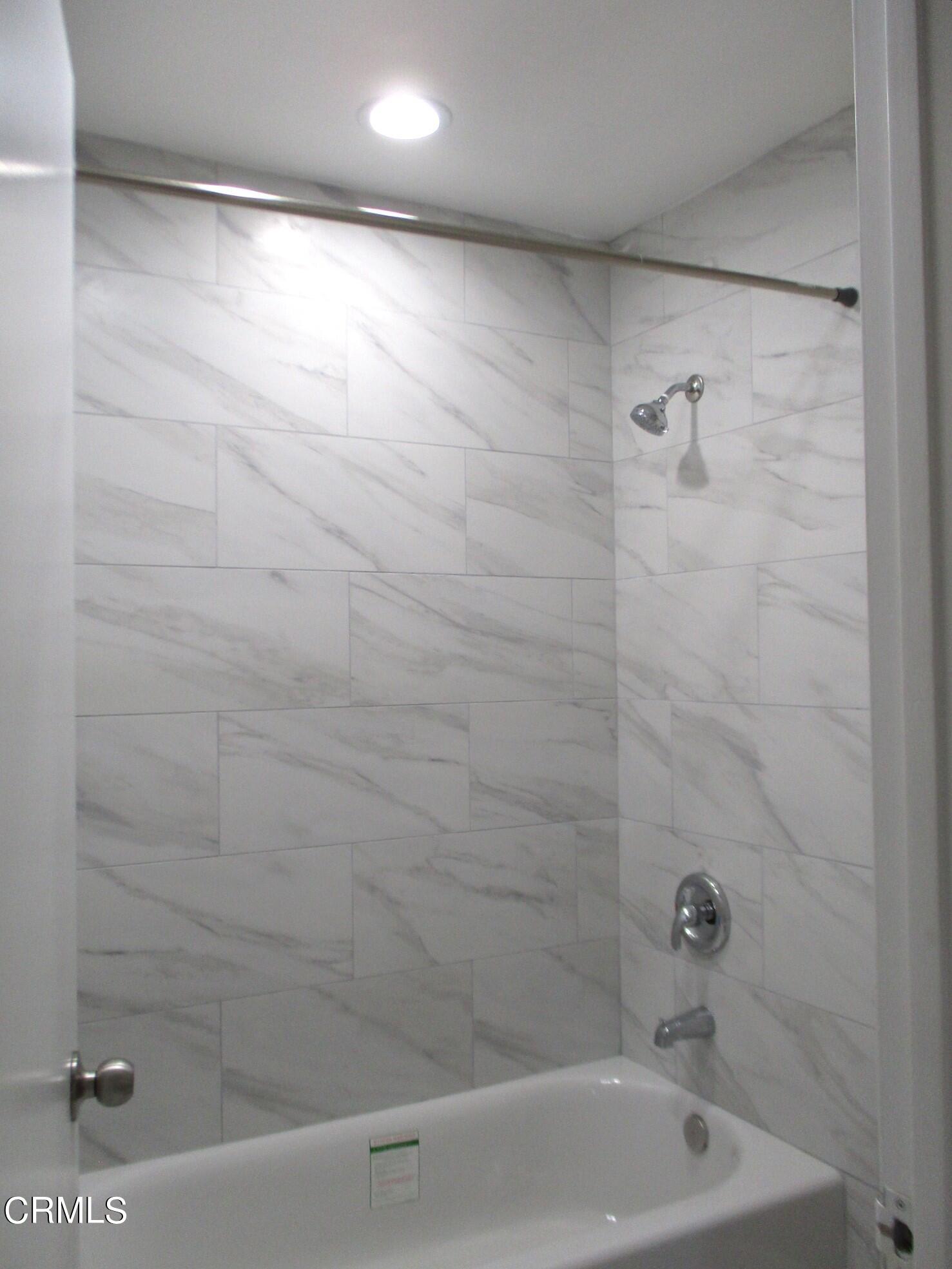 375 West Walnut Street Pasadena, CA 91103 - Photo 22 of 42 a close up of a bathtub in a bathroom