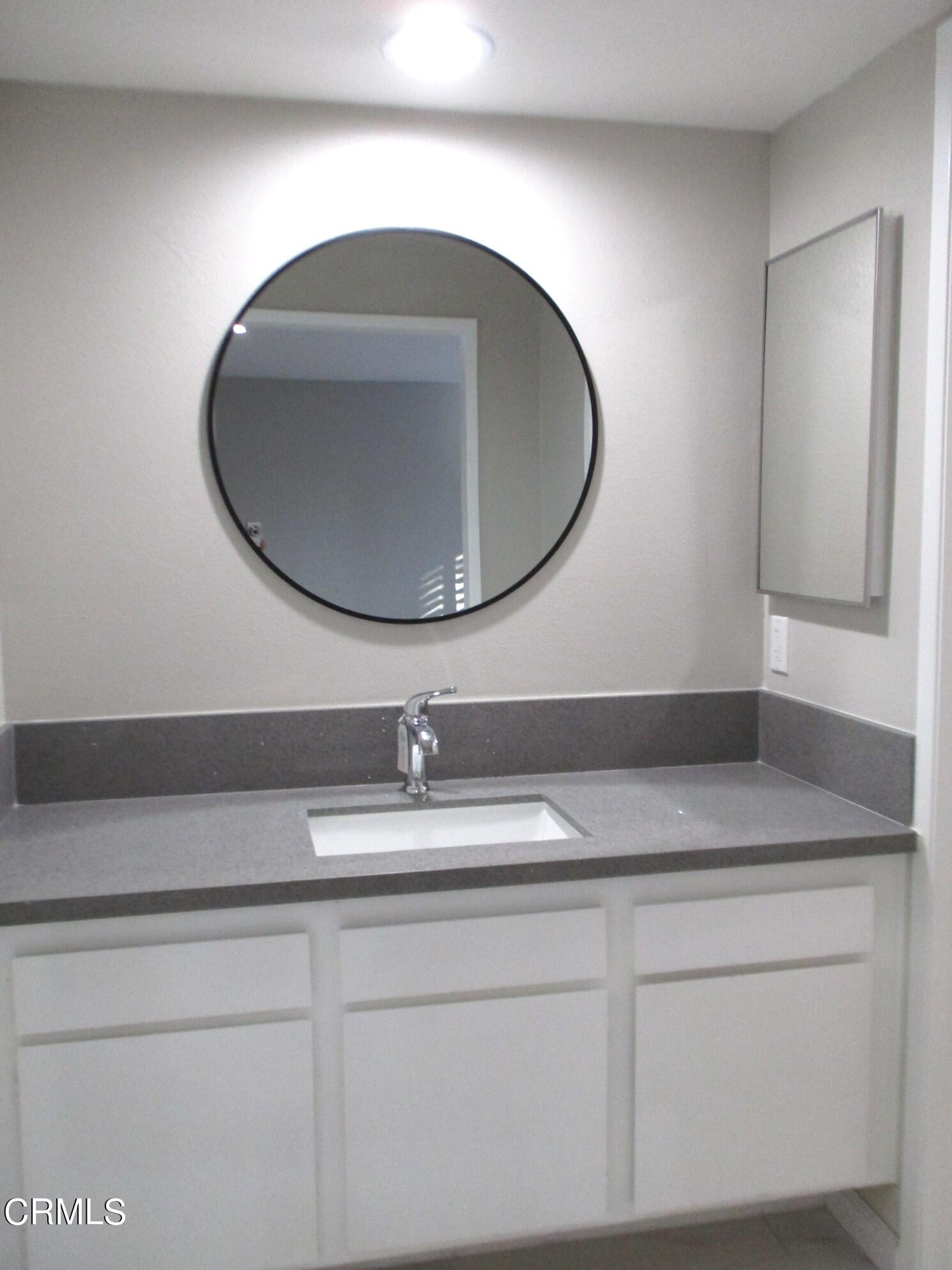 375 West Walnut Street Pasadena, CA 91103 - Photo 25 of 42 a bathroom with a sink and mirror