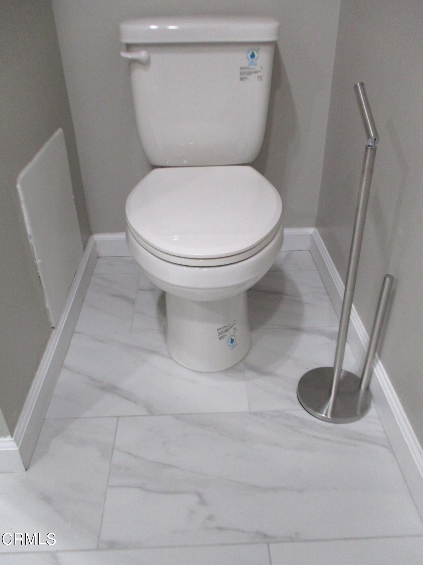 375 West Walnut Street Pasadena, CA 91103 - Photo 28 of 42 a white toilet sitting next to a shower
