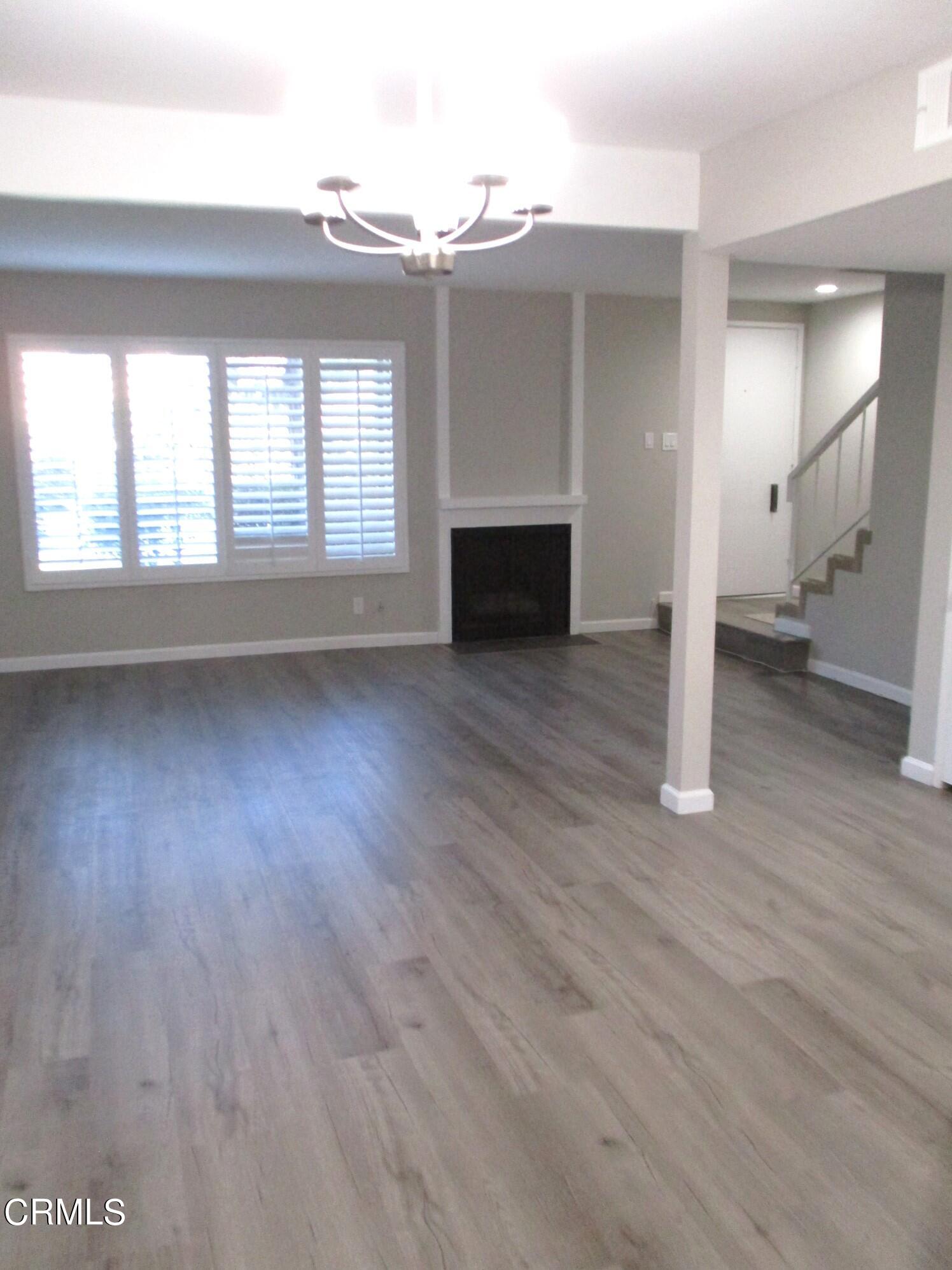 375 West Walnut Street Pasadena, CA 91103 - Photo 4 of 42 wooden floor in an empty room with a fireplace