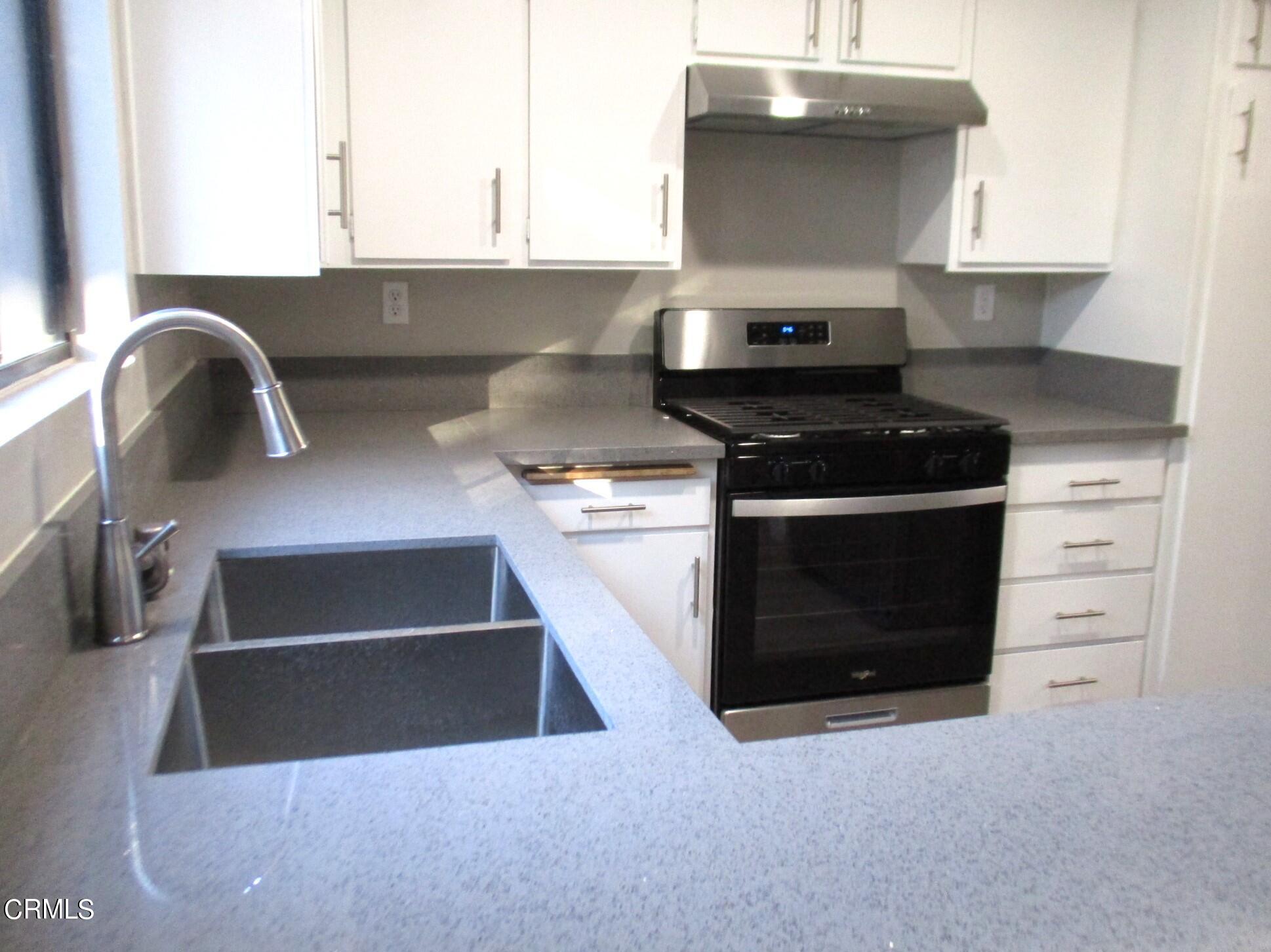 375 West Walnut Street Pasadena, CA 91103 - Photo 7 of 42 a kitchen with a stove and a sink
