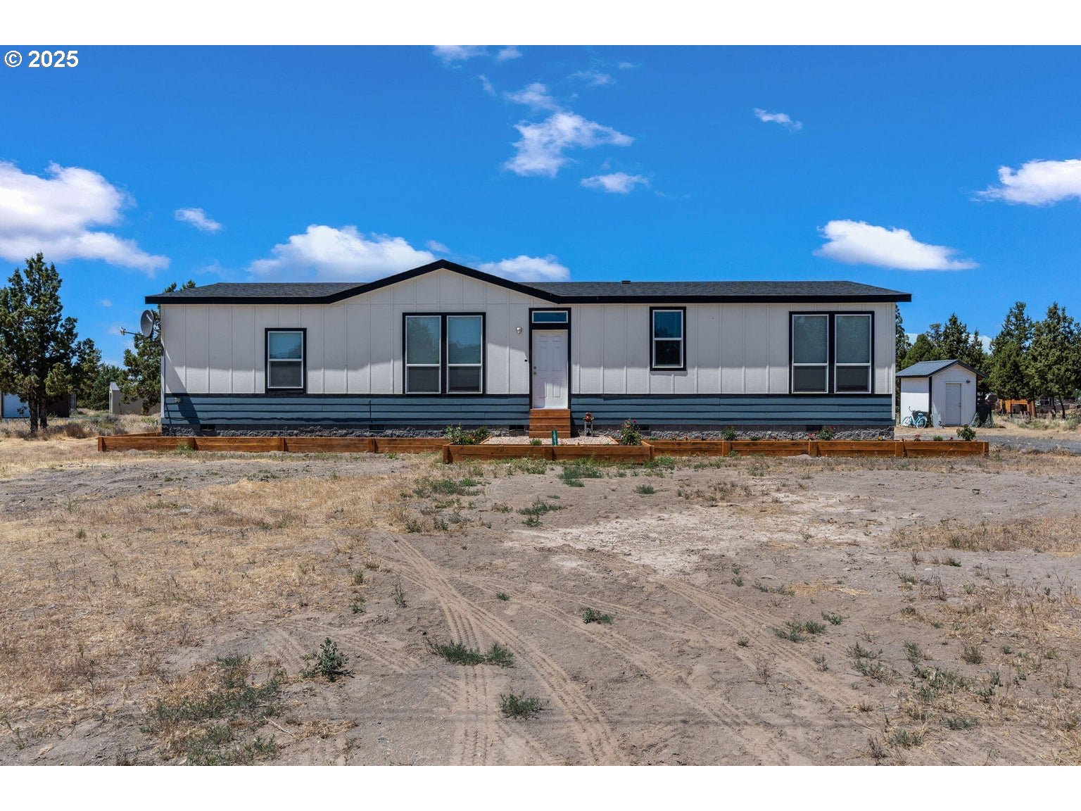 16277 Southeast Cahvilla Road Prineville, OR 97754 - Photo 12 of 22 a view of a house with a yard
