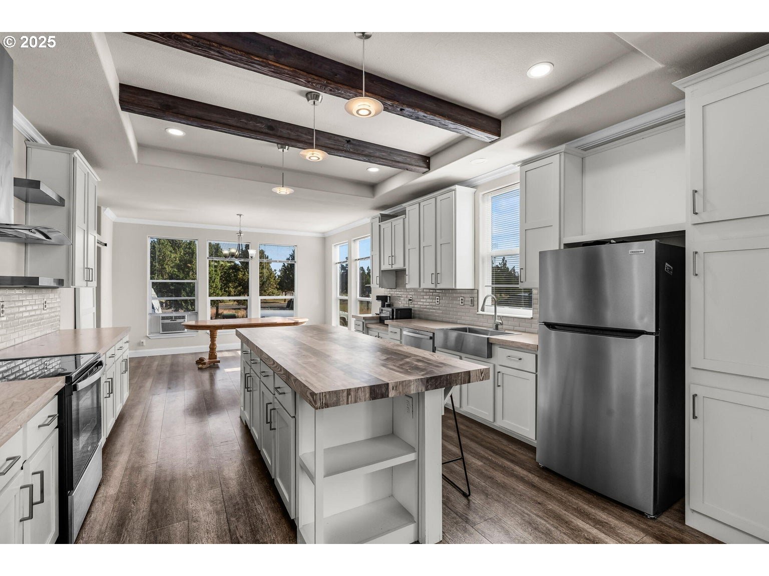 16277 Southeast Cahvilla Road Prineville, OR 97754 - Photo 21 of 22 a kitchen with refrigerator and wooden floor